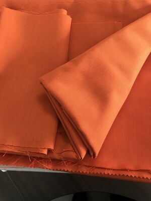 Tejido de revestimiento Tejido de aramida Resistencia al calor 260 grados Material resistente y duradero Ideal para ropa de seguridad e industrial