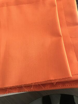 Tejido de revestimiento Tejido de aramida Resistencia al calor 260 grados Material resistente y duradero Ideal para ropa de seguridad e industrial