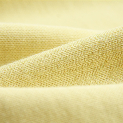Tela hecha punto Aramid doble de la meta de la cara el 50% Para Aramid el 50% cruda para los guantes cortados de la resistencia